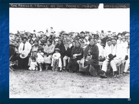 Quanah Parker Monument Unveiling, 1930. The small boy standing in front is Lance Tahmahkera's father, Monroe. The man in braids on the far right is Baldwin Parker, Quanah’s oldest son.