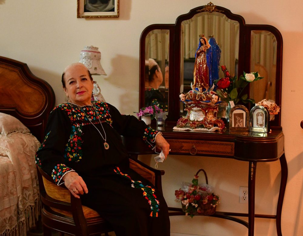 Dorothy Caram at her Houston home, pictured with a 19th century Virgen de Guadalupe, an heirloom from her great-great-grandmother who was lady in waiting to Carlota of Mexico. 