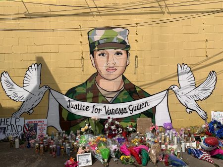 A mural depicts a sillhouette of Vanessa Guillen in Army fatigues and the words "Justice for Vanessa Guillen," at Taqueria Del Sol in Houston.