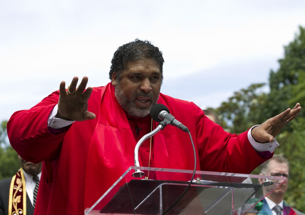 FILE - In this June 12, 2019, file photo, the Rev. William J. Barber accompanied by faith leaders speaks during a rally outside of the White House, protesting against President Donald Trump policies in Washington. To many, it seems that the people calling for easing restrictions meant to slow the spread of the new coronavirus  — who have been predominantly white — are agitating for reopening because they won’t be the ones to suffer the consequences. “The issue is not what these protests are saying to just black people but what they are saying to poor and low-income people who are the most impacted," said Barber.  (AP Photo/Jose Luis Magana, File)