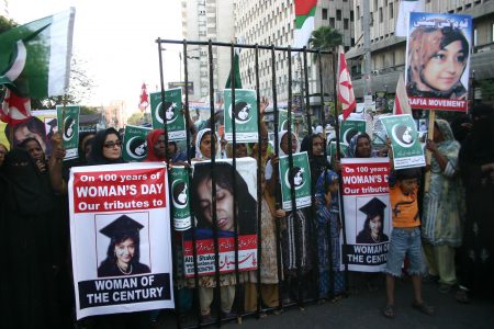 People rally demanding the release of Aafia Siddiqui, who was convicted in February 2010 of two counts of attempted murder, and who is currently being detained in the U.S. during International Women's Day in Karachi, Pakistan March 8, 2011.