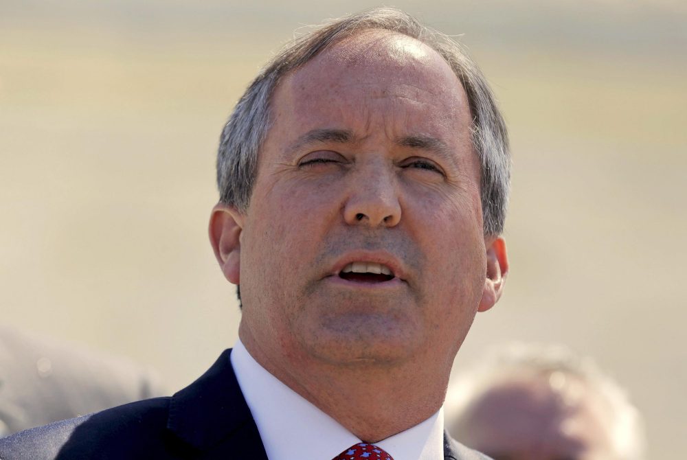 Attorney General Ken Paxton speaks outside the U.S. Supreme Court in 2016.