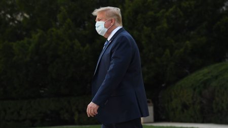 President Trump leaves Walter Reed National Military Medical Center in Bethesda, Md., on Monday. He announced Tuesday he was pausing negotiations on a coronavirus relief package.