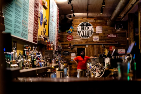 A bartender waited for customers at Buck Wild in downtown Austin after bars reopened in May. Gov. Greg Abbott closed bars down again in June after a spike in COVID-19 cases in the state.
