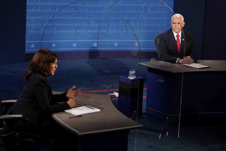 Vice President Mike Pence looks at Democratic vice presidential candidate Sen. Kamala Harris, D-Calif., as she answers a question during the vice presidential debate Wednesday, Oct. 7, 2020, at Kingsbury Hall on the campus of the University of Utah in Salt Lake City.