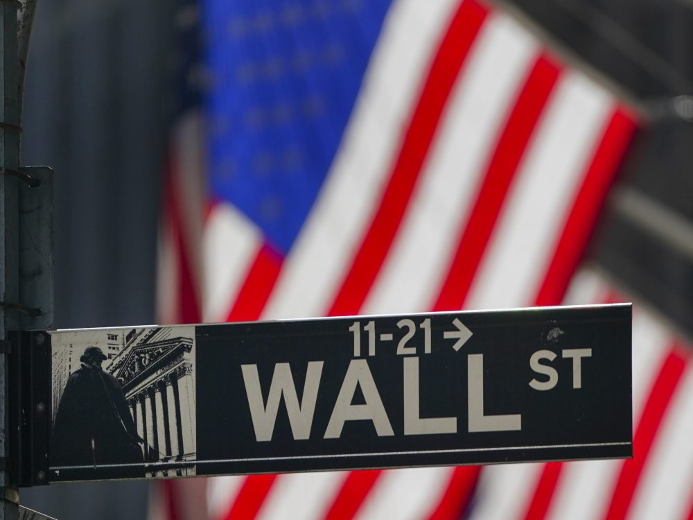 The U.S. flag hangs outside the New York Stock Exchange earlier this month. Investors have been grappling with a wave of uncertainty that's sent the market lower in recent weeks.