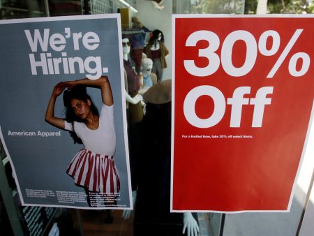 Signs in the window of a retail store offers discounts, and jobs, in Santa Monica, Calif. U.S. GDP grew at a record-setting rate, reflecting pent-up activity after the coronavirus lockdowns, but economists warn of trouble ahead.