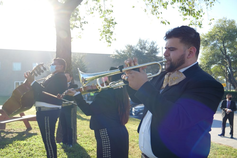 A mariachi band plays for voters outside the Ripley House polling place in Houston's East End on Election Day, Nov. 3, 2020.
