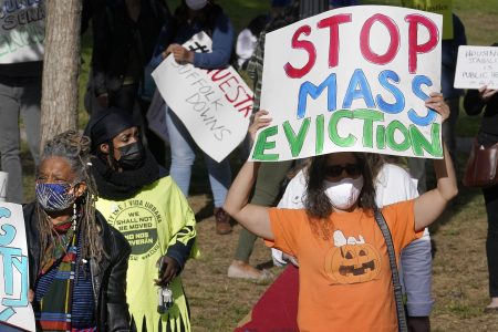 Protesters call for support for tenants and homeowners at risk of eviction during a demonstration on Oct. 11 in Boston. A federal moratorium on evictions is set to expire at the end of December.