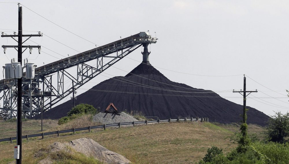 This July 29, 2013, file photo shows a Luminant Mining Co. coal mine working in Tatum, Texas.