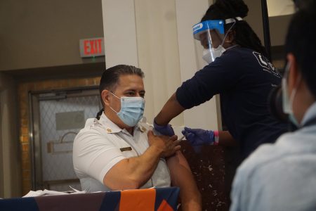 Houston Fire Chief Samuel Peña gets his first COVID-19 vaccine dose on Jan. 5, 2020.