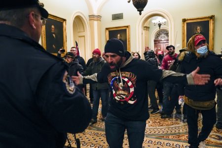 Protesters gesture to U.S. Capitol Police in the hallway outside of the Senate chamber inside the Capitol on Wednesday.