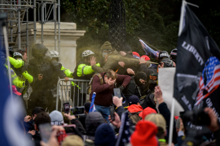 210106 Pro-Trump supporters and police clash outside the United States Capitol Building during a March to Save America Rally on January 6, 2021 in Washington, DC, USA.