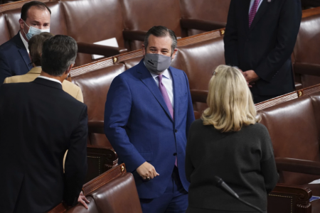 Sen. Ted Cruz, R-Texas, arrives as a joint session of the House and Senate convenes to confirm the Electoral College votes cast in November's election, at the Capitol in Washington, Wednesday, Jan. 6, 2021.
