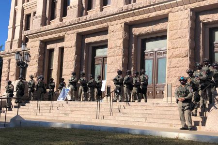 Texas state troopers wearing riot gear stand guard outside the Capitol in Austin, Texas, on Tuesday, Jan. 12, 2021, for the opening of the legislative session. The Texas Department of Public Safety has increased its presence at the state Capitol after last week's deadly attack on the U.S. Capitol by supporters of President Donald Trump. The FBI also has warned of plans for armed protests at all 50 state capitals and in Washington, D.C., in the days leading up to President-elect Joe Biden's inauguration.