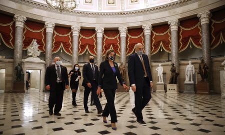 House Speaker Nancy Pelosi, D-Calif., heads to the House Chamber at the U.S. Capitol Tuesday. The House is debating whether to impeach President Trump a second time on Wednesday.