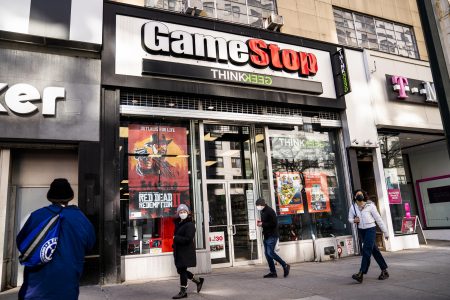 FILE - Pedestrians pass a GameStop store on 14th Street at Union Square, Thursday, Jan. 28, 2021, in the Manhattan borough of New York.  GameStop shares are on track for their biggest one-day loss ever, extending a skid that’s cleaved off some of its recent blockbuster gains following a social-media led campaign to get the videogame retailer’s stock to skyrocket. Shares were down 46% to about $120 in morning trading Tuesday, Feb. 2, following a 31% decline a day earlier.