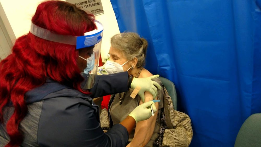 Adele Manouse, mother of "Town Square" host Ernie Manouse, receives her COVID-19 vaccine.