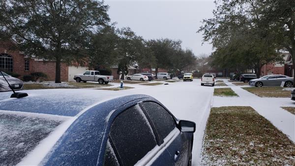 A snowy street in Pearland on Feb. 15, 2021.