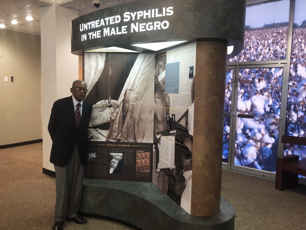 Tuskegee civil rights attorney Fred Gray shows an exhibit on the syphilis study at the Tuskegee History Center. Gray represented the men when the truth about the study came out in 1972. He won a $10 million settlement for the men, and their families.