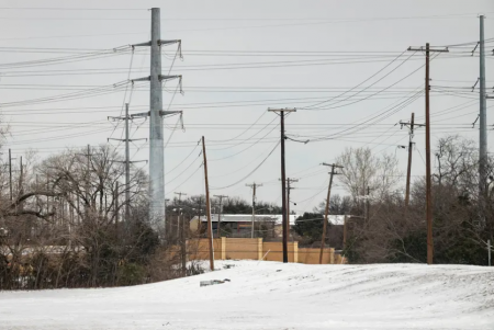 Power lines in Dallas during last week's winter storm. Millions went without power in Texas for days last week, and on Wednesday the grid operator's board acknowledged Texans' suffering.