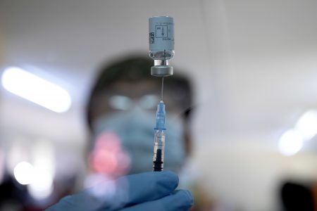 A healthcare worker fills a syringe from a vial with a dose of the Johnson & Johnson vaccine against the COVID-19 coronavirus as South Africa proceeds with its inoculation campaign at the Klerksdorp Hospital on February 18, 2021.
