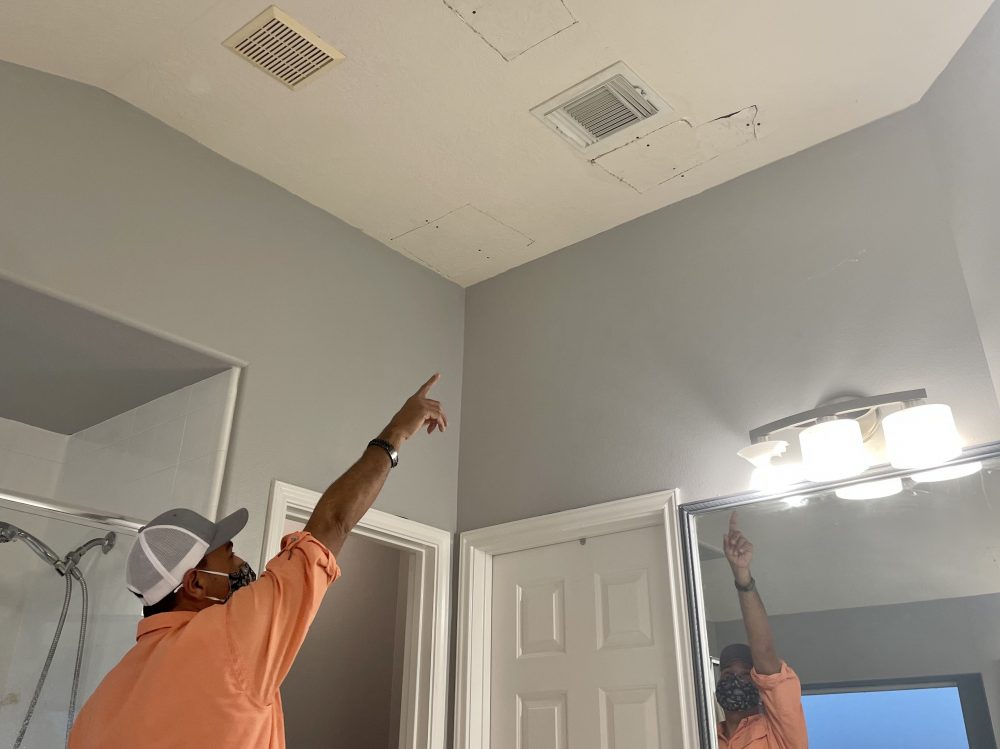 Dolande said he had to cut holes in his bathroom ceiling to reach the broken pipes. 