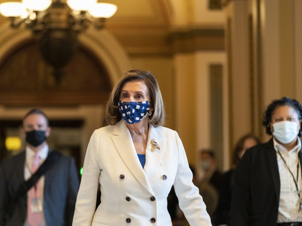 House Speaker Nancy Pelosi walks from the House floor during the vote on the $1.9 trillion COVID-19 relief bill Wednesday. Despite Republican criticism that the bill has provisions unrelated to the pandemic, Pelosi insists the bill is "coronavirus-centric."