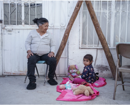 Eda Cristelia Melendez Vallecillo, 70, from Honduras is pictured with her granddaughter Linda, 3, at "Albergue Para Migrantes El Buen Samaritano," in Ciudad Juarez, Mexico on March 9, 2021. She was injured while trying to cross the U.S.-Mexico border and was taken to the shelter by Grupos Beta, but she still hopes to seek asylum to reach her children in the United States.