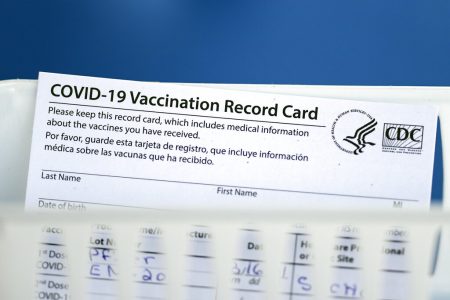 A vaccination record card is shown during a COVID-19 vaccination drive for Spring Branch Independent School District education workers Tuesday, March 16, 2021, in Houston. School employees who registered were given the Pfizer vaccine.