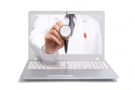 Telemedicine concept. Doctor with a stethoscope on the computer laptop screen
