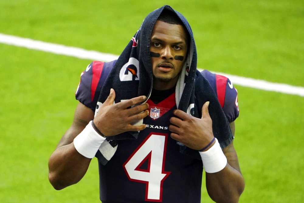 In this Jan. 3, 2021, file photo, Houston Texans quarterback Deshaun Watson walks off the field before an NFL football game against the Tennessee Titans in Houston. Thirteen women have accused Watson of sexual assault in separate lawsuits. 