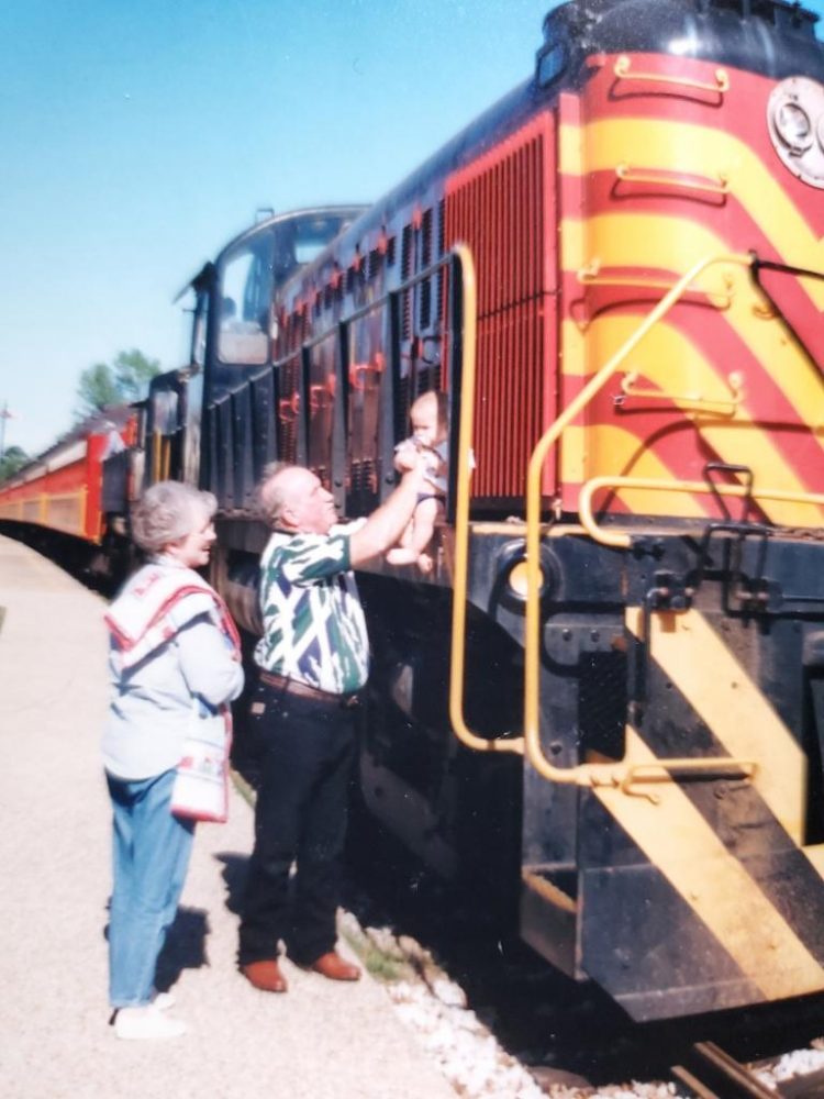 Carrol, "Andy," Anderson with his wife Gloria and their grandson. Andy worked for the Port Terminal Railroad Association for decades and his family says he had a passion for trains.