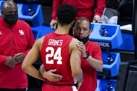 Houston guard Quentin Grimes (24) gets a hug from head coach Kelvin Sampson at the end of a men's Final Four NCAA college basketball tournament semifinal game against Baylor, Saturday, April 3, 2021, at Lucas Oil Stadium in Indianapolis.