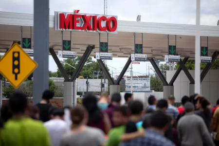 Migrants walked across International Bridge Two into Mexico from the United States in the summer of 2019. They requested asylum in the U.S. but were returned to Mexico to await their court proceedings.