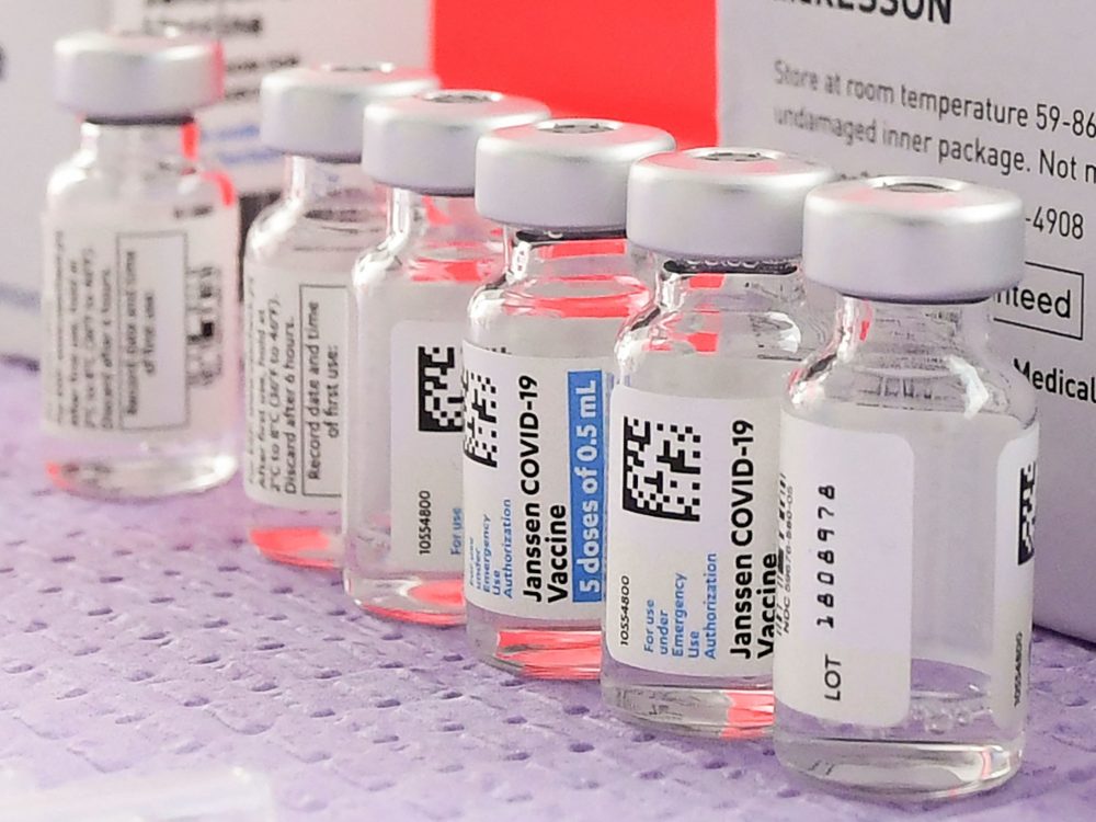 Bottles of the single-dose Johnson & Johnson COVID-19 vaccine await transfer into syringes for administering last month in Los Angeles before the vaccine's pause.