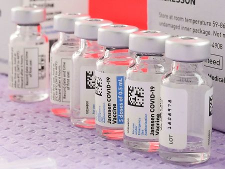 Bottles of the single-dose Johnson & Johnson COVID-19 vaccine await transfer into syringes for administering last month in Los Angeles before the vaccine's pause.