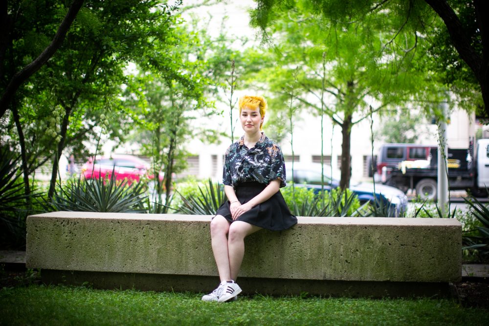 Indigo Giles on the campus of the University of Texas in Austin on Apr. 27, 2021. Giles, who is gender nonbinary, had top surgery performed in high school -- something that would be illegal under a slate of bills currently making their way through the Texas Legislature.