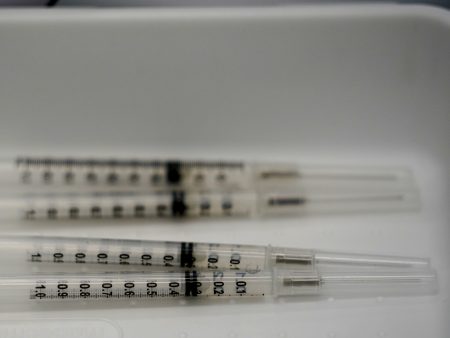 Syringes filled with the Pfizer-BioNTech COVID-19 vaccine are shown in April at the Christine E. Lynn Rehabilitation Center in Miami.