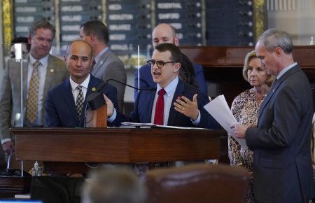 Rep. Briscoe Cain, R-Houston, center, stands with co-sponsors as he answers questions and speaks in favor of HB 6, an election bill, in the House Chamber at the Texas Capitol in Austin, Texas, Thursday, May 6, 2021.