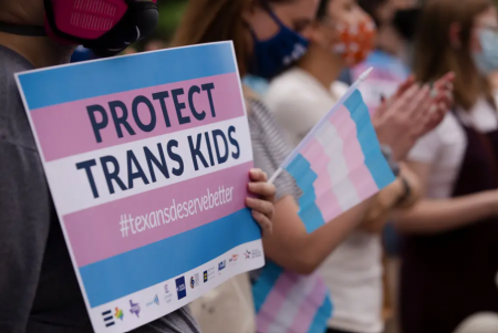 Protestors participate in a rally against anti-transgender legislation at the southern steps of the state Capitol on April 28.
