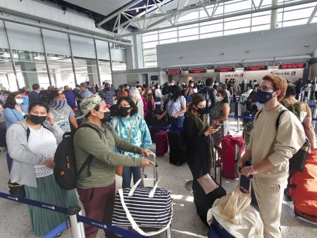 Airline passengers wait to check-in at George Bush Intercontinental Airport Sunday, May 16, 2021, in Houston. Airline travel is increasing as more Americans are getting the COVID-19 vaccination.