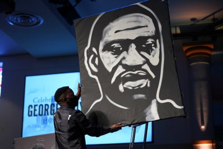 In this June 9, 2020, file photo a man draws an image of George Floyd during the funeral service for Floyd at The Fountain of Praise church in Houston. Americans' suggestions of suitable statues for President Donald Trump's planned National Garden of American Heroes are in, and they look considerably different from the predominantly white worthies that the administration has locked in for many of the pedestals. Lehigh County, Pennsylvania Commissioner Amy Zanelli, suggested George Floyd, Breonna Taylor, and other Black Americans whose killings by police sparked massive street protests.