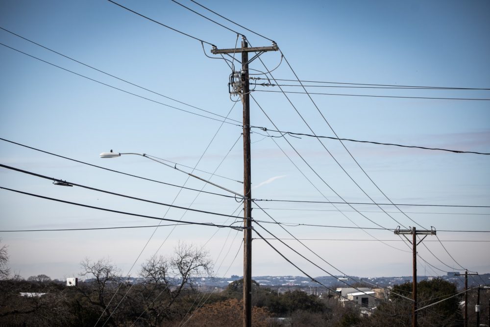 Power lines in South Austin during February's winter storm. The Electric Reliability Council of Texas is asking people to conserve power as much as possible amid high demand for electricity and several forced outages.