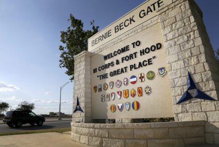 FILE - In this July 9, 2013, file photo, traffic flows through the main gate past a welcome sign in Fort Hood, Texas. A new study finds that female soldiers at Army bases in Texas, Colorado, Kansas and Kentucky face a greater risk of sexual assault and harassment than those at other posts, accounting for more than a third of all active duty Army women sexually assaulted in 2018. The study by RAND Corporation was released Friday.