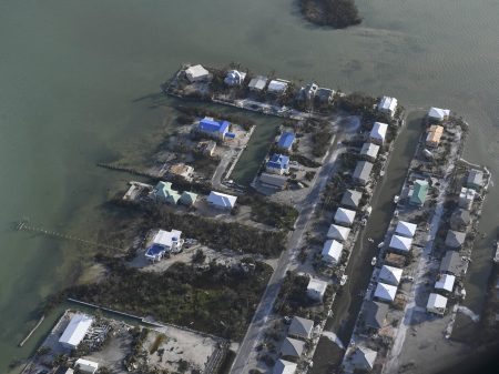 In this Sept. 11, 2017, photo, damaged houses are shown in the aftermath of Hurricane Irma in the Florida Keys. The hurricanes that battered Texas and Florida likely spawned the worst disaster-created housing crunch since Hurricane Katrina left hundreds of thousands of Gulf Coast residents without homes more than a decade ago. (Matt McClain/The Washington Post via AP, Pool)