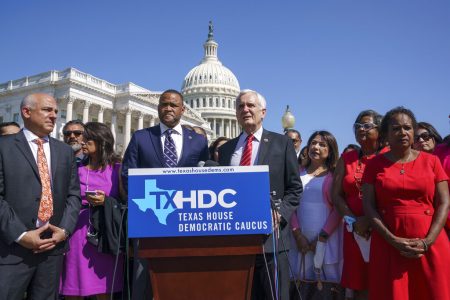 Rep. Marc Veasey, D-Texas, center left, and Rep. Lloyd Doggett, D-Texas, joined at left by Rep. Chris Turner, chairman of the Texas House Democratic Caucus, welcome Democratic members of the Texas legislature at a news conference at the Capitol in Washington, Tuesday, July 13, 2021. The lawmakers left Austin hoping to deprive the Texas Legislature of a quorum — the minimum number of representatives who have to be present for the body to operate, as they try to kill a Republican bill making it harder to vote in the Lone Star State.