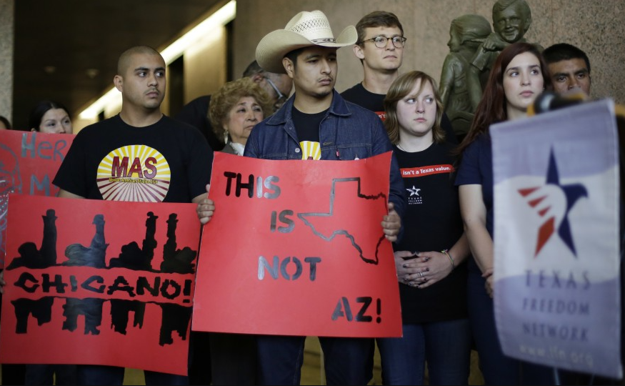 Supporters of a proposal to add a Mexican-American studies course as a statewide high school elective arrive for Texas arrive for a 2014 Texas Board of Education hearing in Austin.