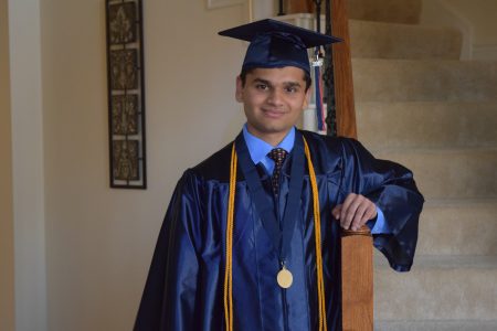 Animesh Namjoshi poses for a graduation photo after receiving his diploma at Seven Lakes High School in Katy.