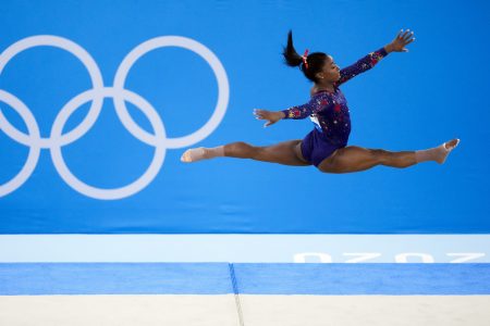 Simone Biles, of United States, performs her floor exercise routine during the women's artistic gymnastic qualifications at the 2020 Summer Olympics, Sunday, July 25, 2021, in Tokyo.